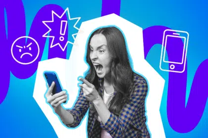 Wütende Frau schreit in ihr Smartphone und zeigt mit dem Finger darauf, umgeben von Symbolen für Ärger und Warnhinweise.