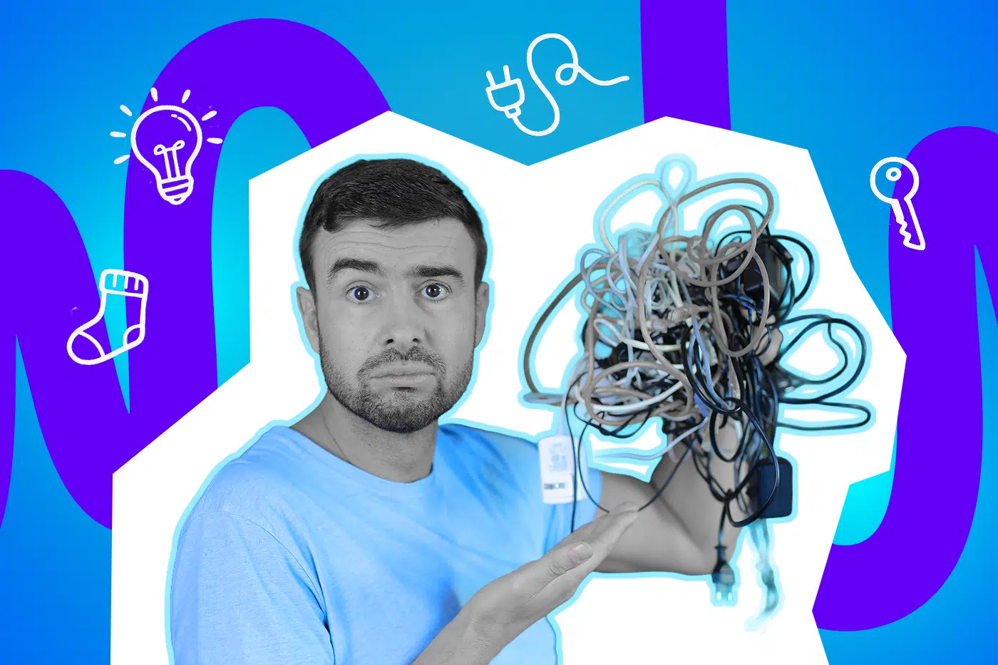 Mann hält großen Kabelsalat hoch und schaut irritiert.